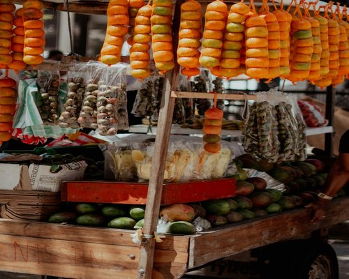 Fresh local tropical fruits displayed in a wooden market stall